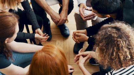 Students sitting in a circle discussing