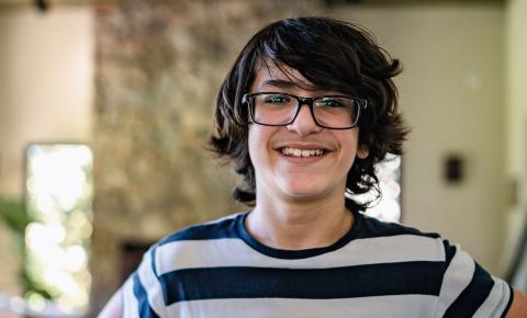 Caucasian high school boy wearing striped tee-shirt